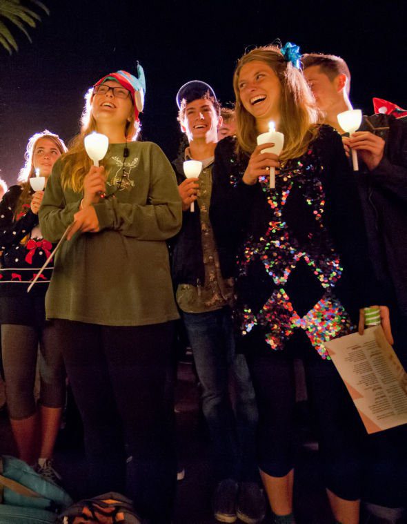 Students Light Christmas Candles