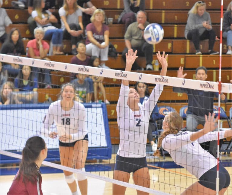 sports – Freshman setter Isabel Zelaya sets   the ball for a teammate.jpg