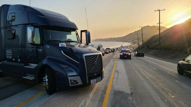 Eastbound lane of PCH blocked due to over turned semi truck; consider alternative routes