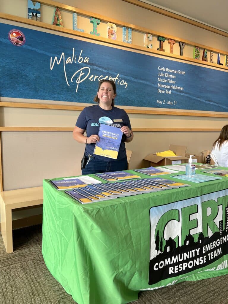 Emergency Services Coordinator Sarah Kaplan volunteering at a CERT information booth during the 2022 Safety Expo in June 2022