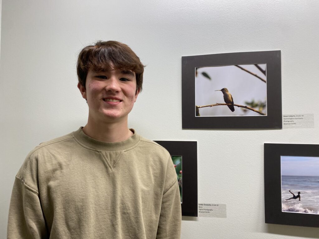 Malibu High sophomore Grant Folkerts poses with his photo Hummingbird Sanctuary at the 2023 Student Art Exhibit reception on Feb 26