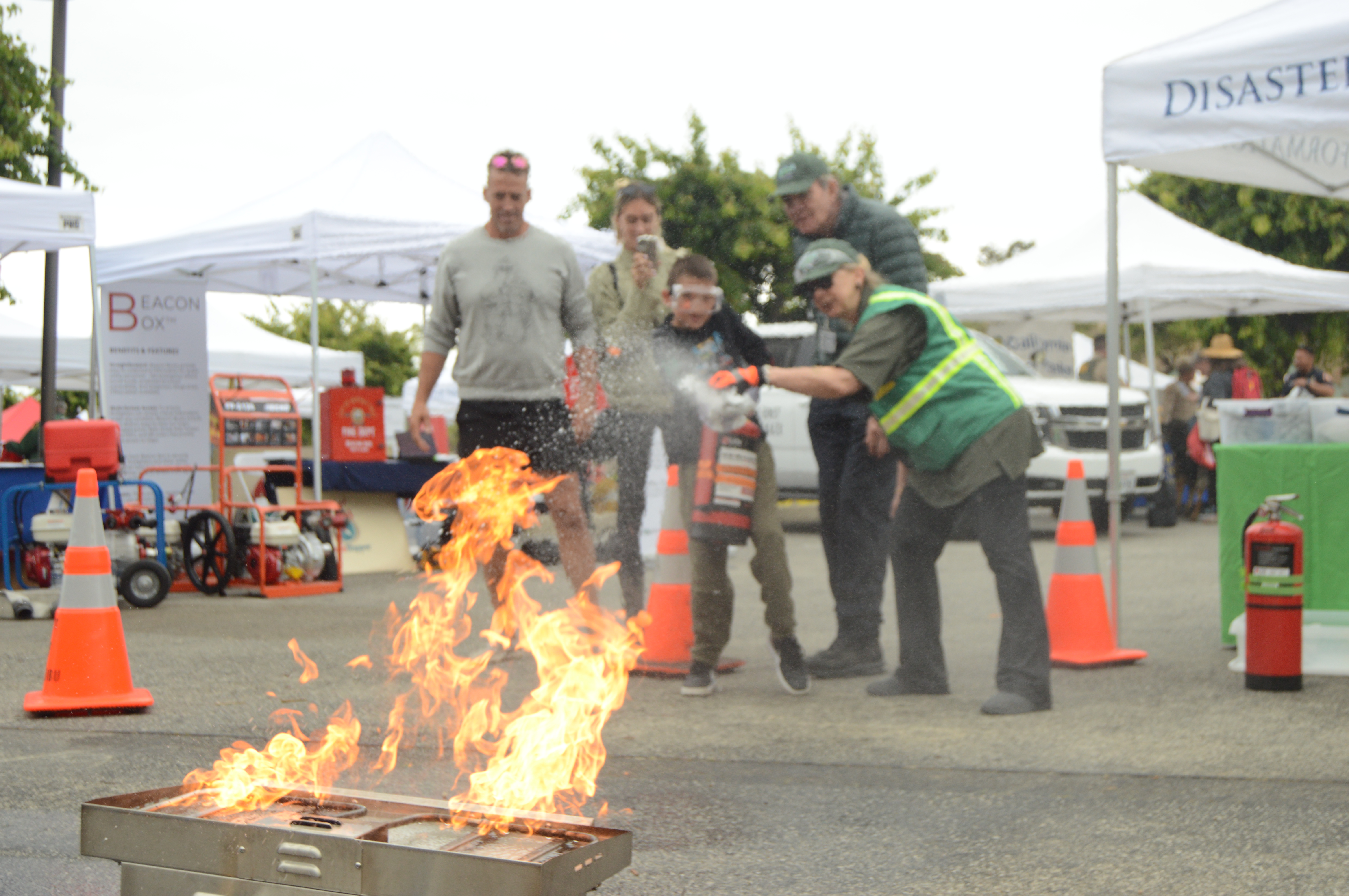 Boonson Schmidt 14 extinguishes a fire with help from the CERT team at the Safety Expo on June 10 2