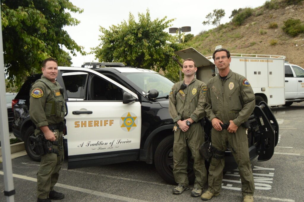 Reserve Deputy Pearson and Civilian Volunteer Specialists Sand and Hollinger of Malibu Search and Rescue pose for a photo at the Safety Expo on June 10 2