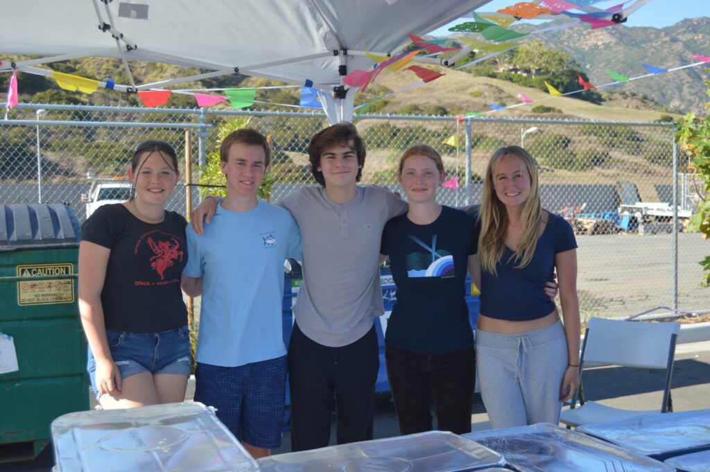 Malibu High School student volunteers pose for a photo before serving food at the fiesta. Left to Right Alex Murphy Topher Hilling Aidan Colburn Vera Kibler Camille Garvin. Photo by Emmanuel Luissi