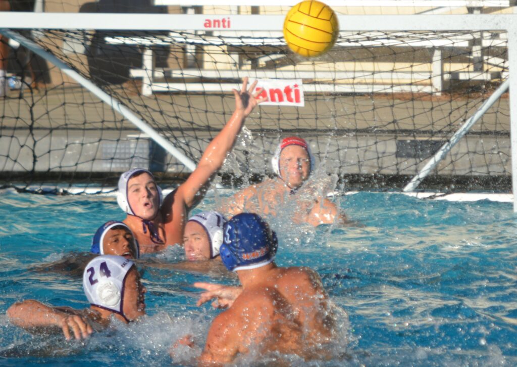 Waves senior attacker Anthony DAmbra No. 5 tosses the ball toward the Cal Lutheran goal. Photo by McKenzie Jackson. 1 1
