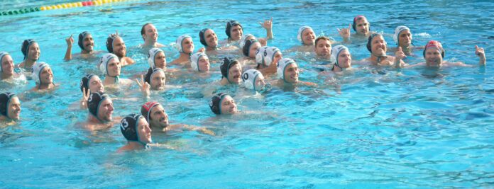 Sharks alumni and high school players take a photo together after their match. Photo by McKenzie Jackson.